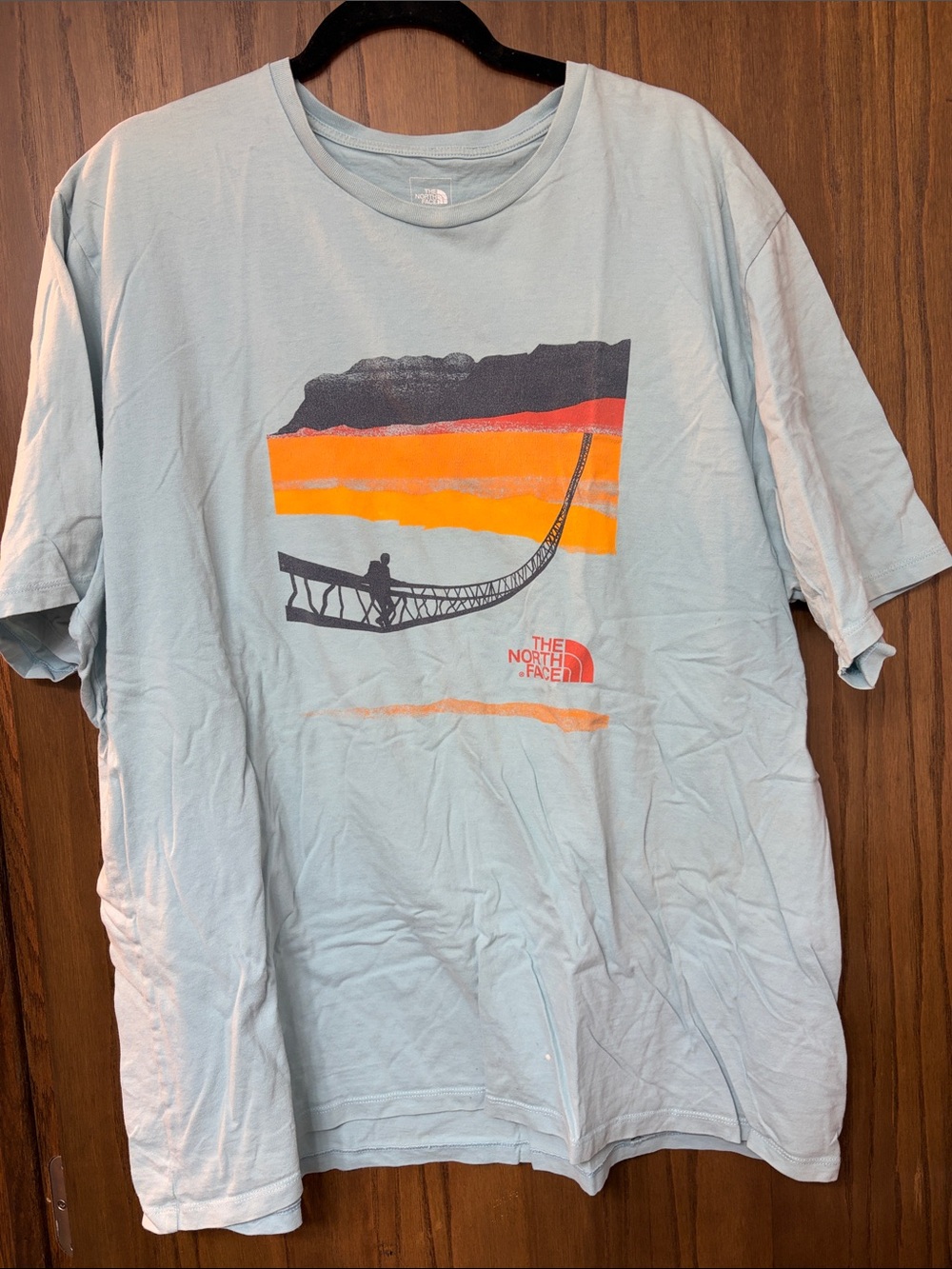 The North Face Men’s Pale Blue Graphic Short Sleeve Tee with Sunset Print